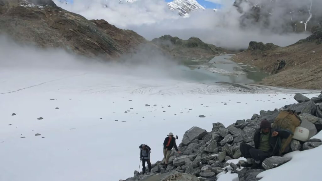Meditation at Vasuki Tal, a serene high-altitude lake near the Himalayas, for a peaceful spiritual experience.